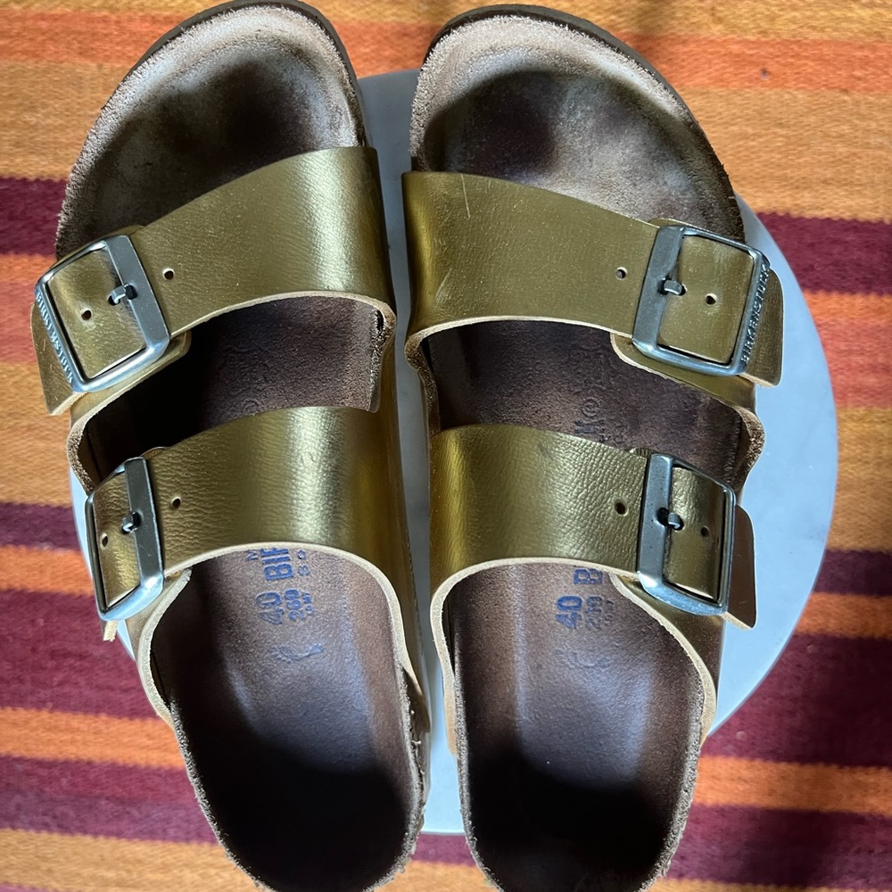 Gold Birkenstocks size 40.